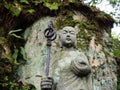 Stone Jizo statue in the mountains