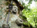 Stone Jizo statue in the mountains