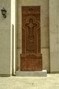 A stone khachkar with the figure of the Virgin and the Child, a round symbol of the sun-eternity, is installed on the right side