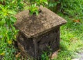 Stone lamp asia, square house with carved walls ornament traditional elephant, old covered Royalty Free Stock Photo