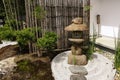 Stone lantern and bamboo partition in traditional Japanese zen garden in Hasedera, Kamakura, Japan Royalty Free Stock Photo