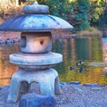 Stone lantern in a Japanese water garden Royalty Free Stock Photo