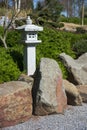 Stone lantern, rock and raked gravel, zen garden landscape design in Japanese style Royalty Free Stock Photo