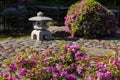 Stone lantern in a Japanese garden. Blurred focus. Royalty Free Stock Photo