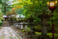 Stone lanterns on pathway in Taiyuin Temple in Nikko, Japan.