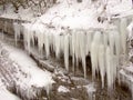 On a stone ledge hanging icicles