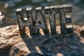 Stone lettering forms the word & x27;HATE Royalty Free Stock Photo