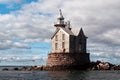 Stone Lighthouse Protects Mariners Royalty Free Stock Photo