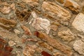 Stone limestone cement wall diagonal blocks beige brown weathered old rough surface texture of the old fence protection decor Royalty Free Stock Photo