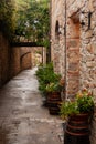 Stone-lined path in the old town of San Donato, Italy. Royalty Free Stock Photo