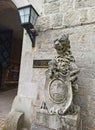 Stone lion with the coat of arms of Smolenice Castle in Neo-Gothic style, Slovakia