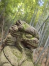 Close up of a lion stone statue in a park. Mythical creatures concept Royalty Free Stock Photo