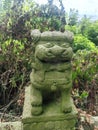 Close up of a lion stone statue in a park. Mythical creatures concept Royalty Free Stock Photo