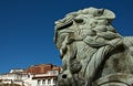 The stone lion in front of the Potala Palace Royalty Free Stock Photo