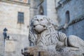 Stone lion guarding the Gothic cathedral of Avila