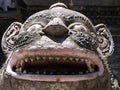 Stone lion head at the entrance gate of Hiranya Varna Mahavihar. Golden temple. Patan, Kathmandu. Nepal