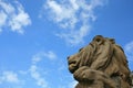 Stone lion head statue in Vienna against blue sky Royalty Free Stock Photo