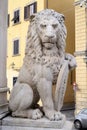 Stone lion holding shield outside of the of Basilica of Santa Croce in Florence