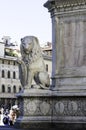 Stone Lion sits at the base of Dante`s Statue in Florence, Italy.