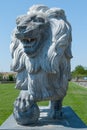 Stone lion, statue of a lion, lion with a ball Royalty Free Stock Photo