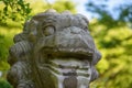 Stone Lion Statue in Natural Setting Royalty Free Stock Photo