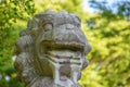 Stone Lion Statue in Natural Setting Royalty Free Stock Photo