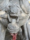 Stone lions on a bridge in a garden