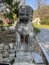 Stone lions on a bridge in a garden