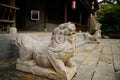Stone lion at entrance of traditional building,Qingyan town