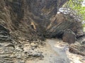 Large rocks accompanied by sea sand and beautiful trees Royalty Free Stock Photo