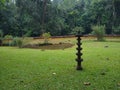 A stone made lighting post called "kal vilakku" seen at hindu temples in south India Royalty Free Stock Photo