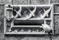 Stone mail slot in a building wall in Barcelona. Beautiful photography with animal theme letterbox.