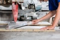 Stone mason woman measuring stone plate for sawing Royalty Free Stock Photo