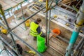 Stone Mason at work on major roof renovation of historic building at Dyrham Park, Gloucestershire, UK