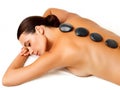 Stone Massage. Beautiful Woman Getting Spa Hot Stones Massage Royalty Free Stock Photo