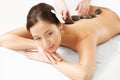 Stone Massage. Beautiful Woman Getting Spa Hot Stones Massage Royalty Free Stock Photo