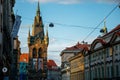 Stone medieval gothic bell Jindrisska Tower at New Town at sunny day, arched windows, blue sky, the highest Henry`s belfry, spier