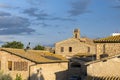 Stone medieval houses in the small town of Monteriggioni in Tuscany, Italy at sunset Royalty Free Stock Photo