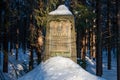 Stone memorial in the winter forest Royalty Free Stock Photo