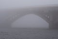 Stone Metro subway bridge in rich fog, mist background. Winter morning view. Kyiv, Ukraine Royalty Free Stock Photo