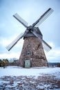 A stone mill against a blue sky. Latvia.