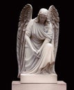 Stone monument of an angel at the cemetery. Isolated on black background Royalty Free Stock Photo