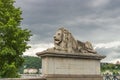 Stone monument of a lion near the Chain Bridge in Budapest