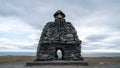 Stone monument to mythological hero Bardur Snaefellsas in Arnarstapi, Iceland