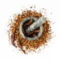 Stone mortar and pestle full of crushed red cayenne pepper, dried chili flakes and seeds isolated on a white background Royalty Free Stock Photo