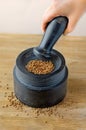 Stone mortar and pestle on the table Royalty Free Stock Photo