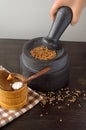Stone mortar and pestle on the table Royalty Free Stock Photo