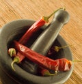 Stone mortar with red chillies Royalty Free Stock Photo