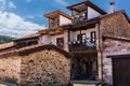 Stone mountain mansions with balconies and flowers. Carmona, Cantabria, Spain