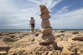 Girl walking next to Stone mounts in the south coast of the island of majorca